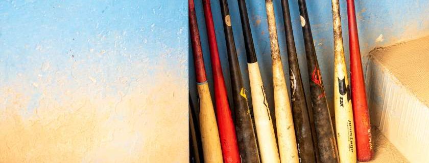 baseball bats on wall and baseball scores